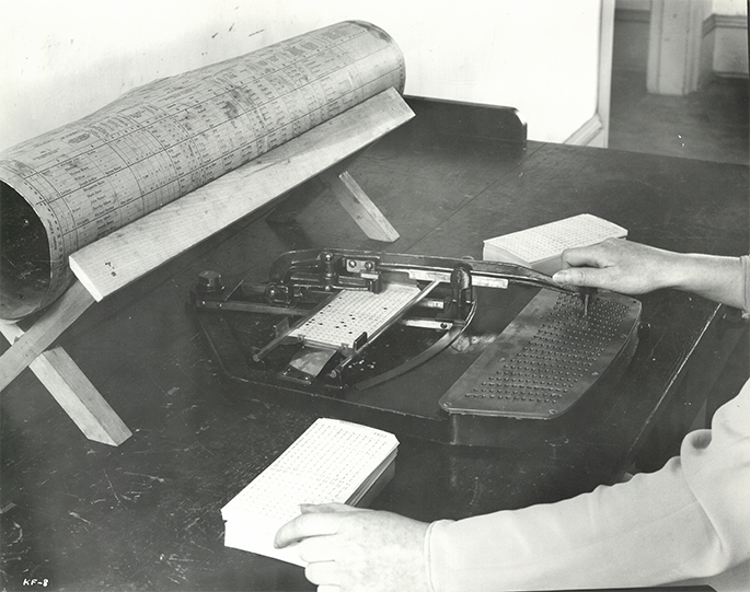 black and white photo of a punch card computer